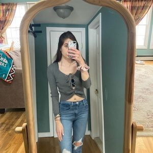 Lace up gray crop sweater.